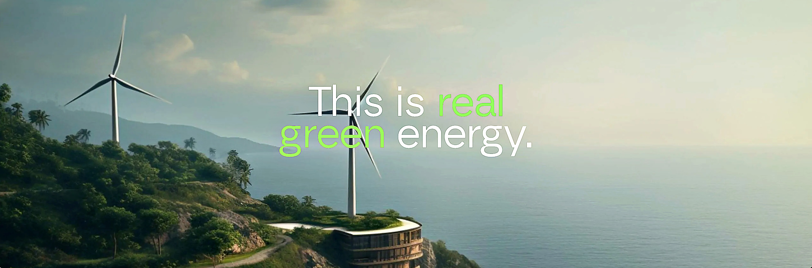 Wind turbines on a green coastal cliff above the ocean — this is real green energy